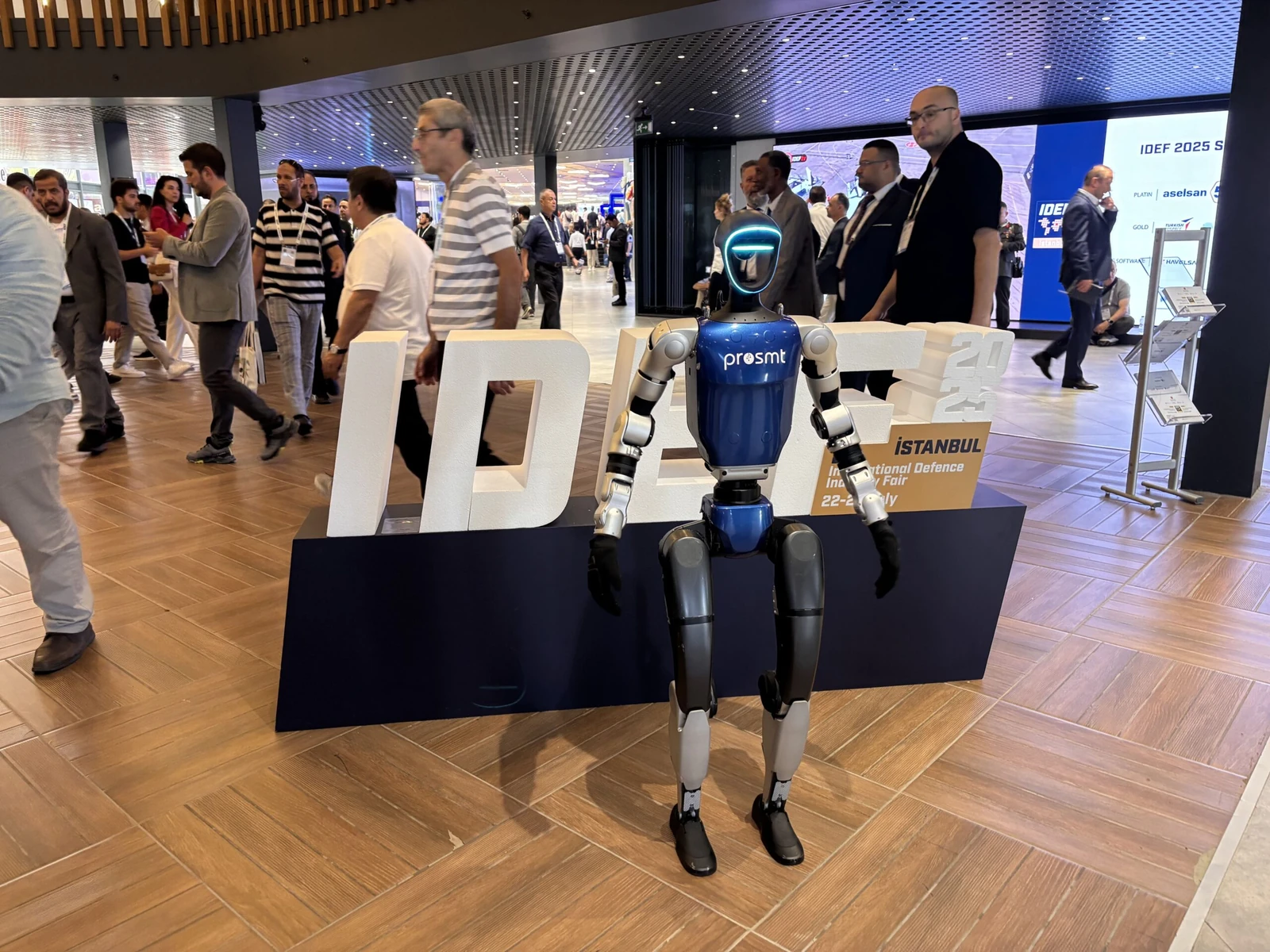Unitree G1 humanoid robot at international defense and aerospace expo, showing event use case deployment