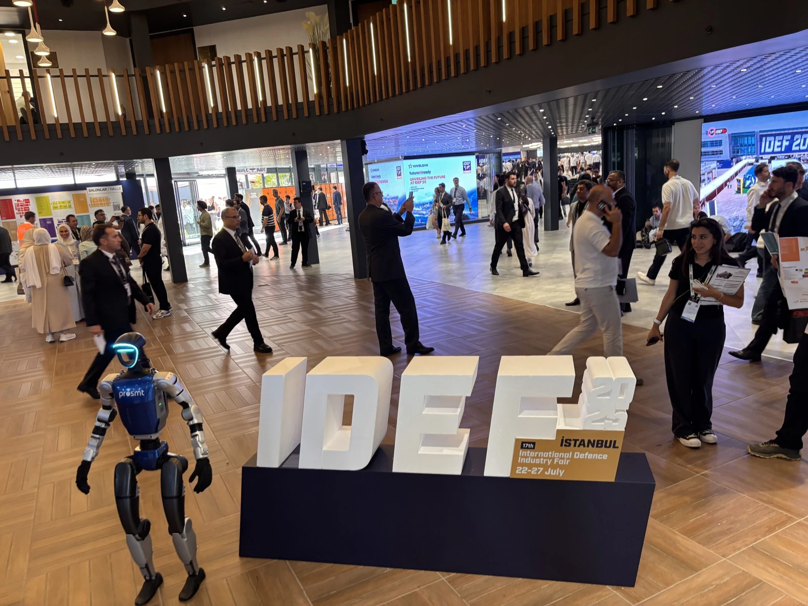 Unitree G1 humanoid robot at IDEF defense expo, showing pre-event setup and professional deployment