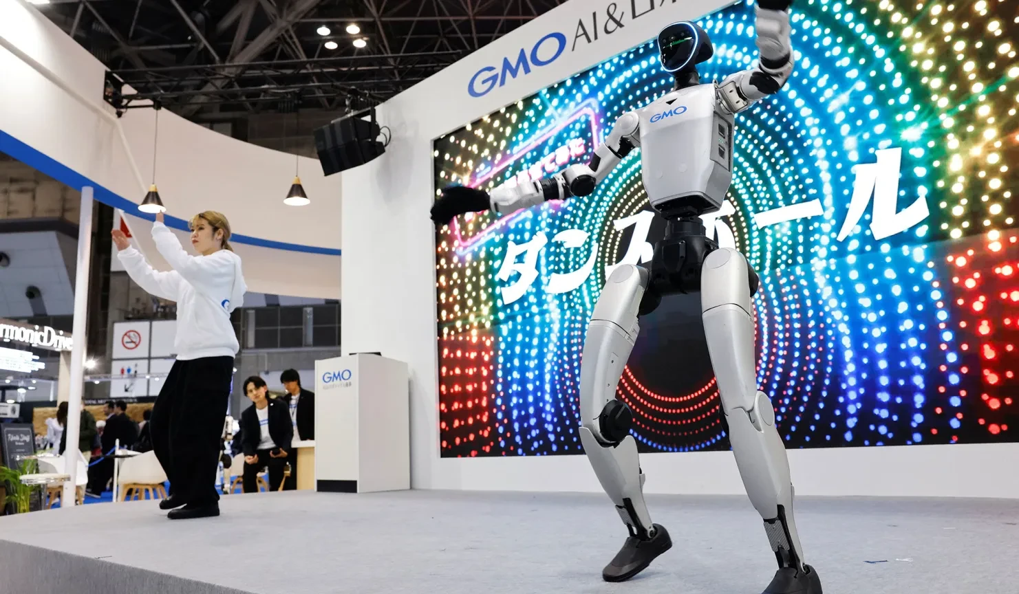 Unitree G1 humanoid robot at a trade show booth demonstrating event rental capabilities