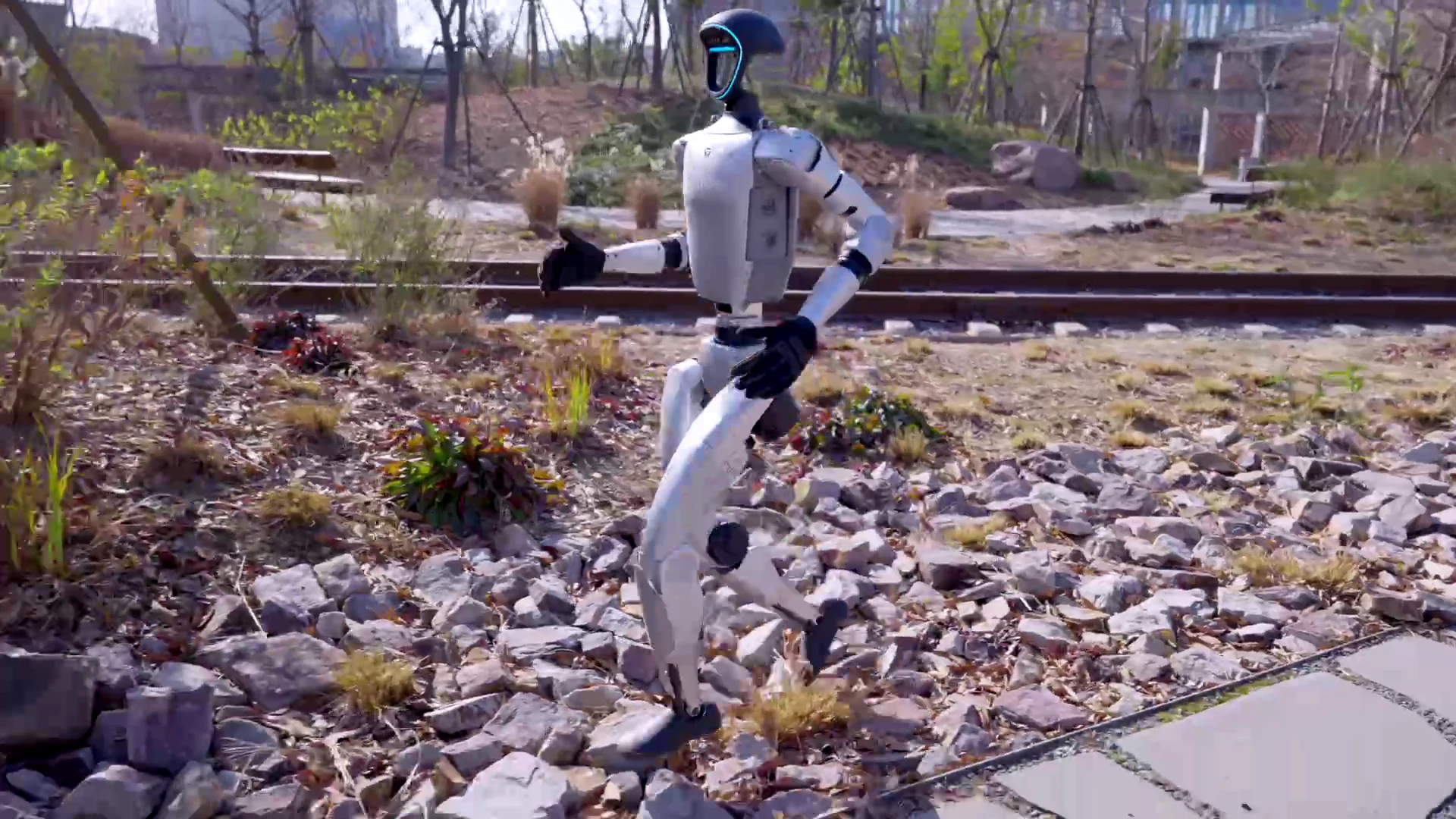 Unitree G1 humanoid robot running on outdoor terrain — renting avoids depreciation on a robot dropping in price annually