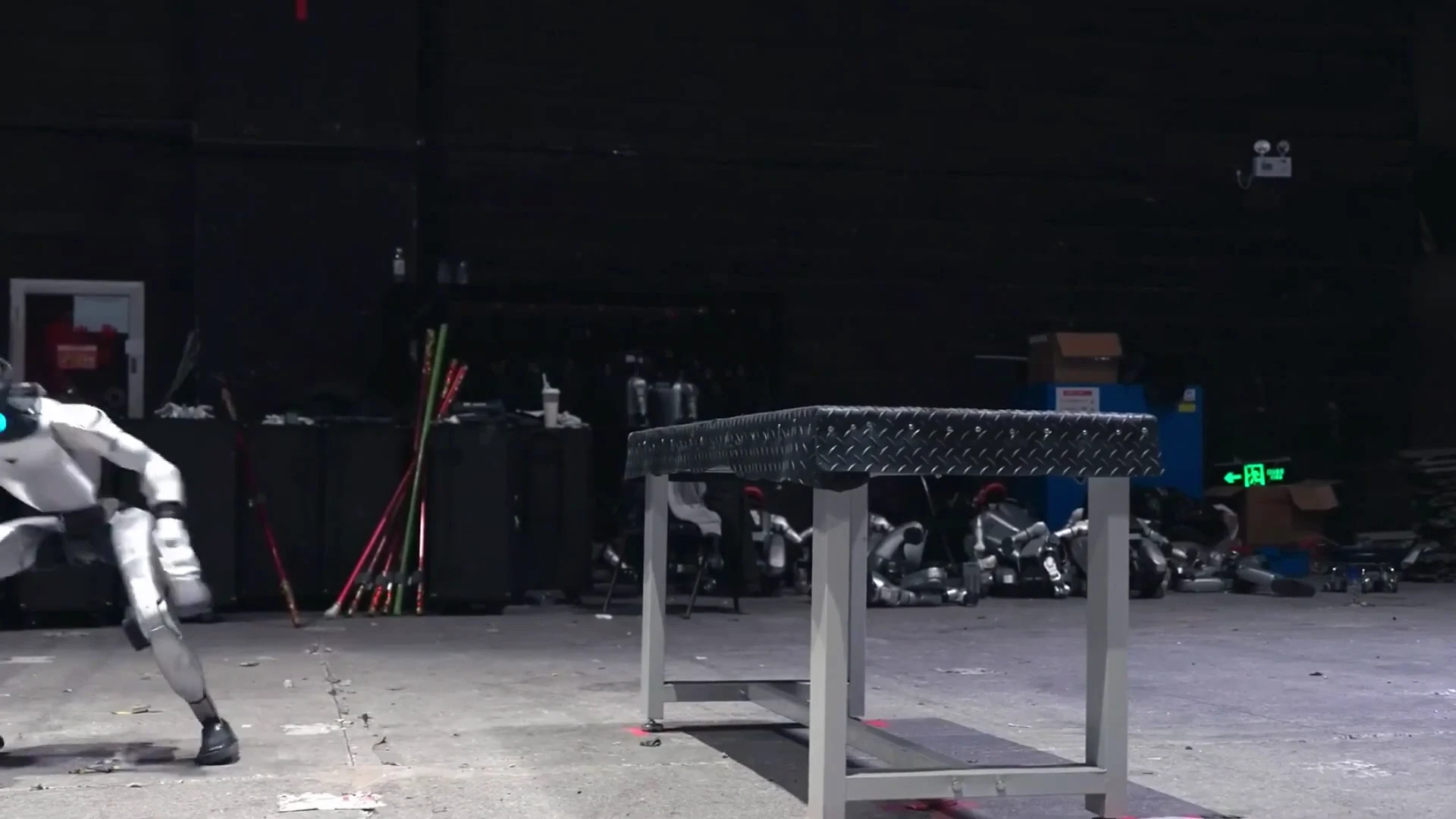 Unitree G1 humanoid robot during indoor warehouse training session learning movement patterns through reinforcement