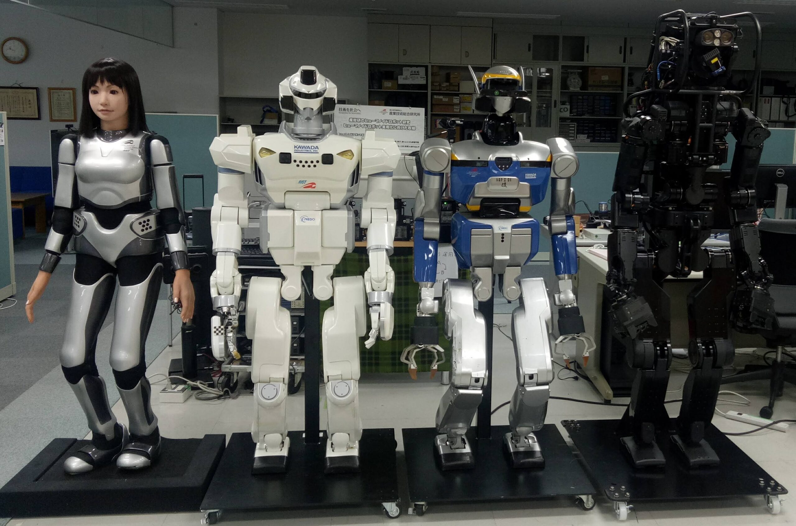 Multiple humanoid robots in a research lab - the result of 30 years of incremental robotics progress