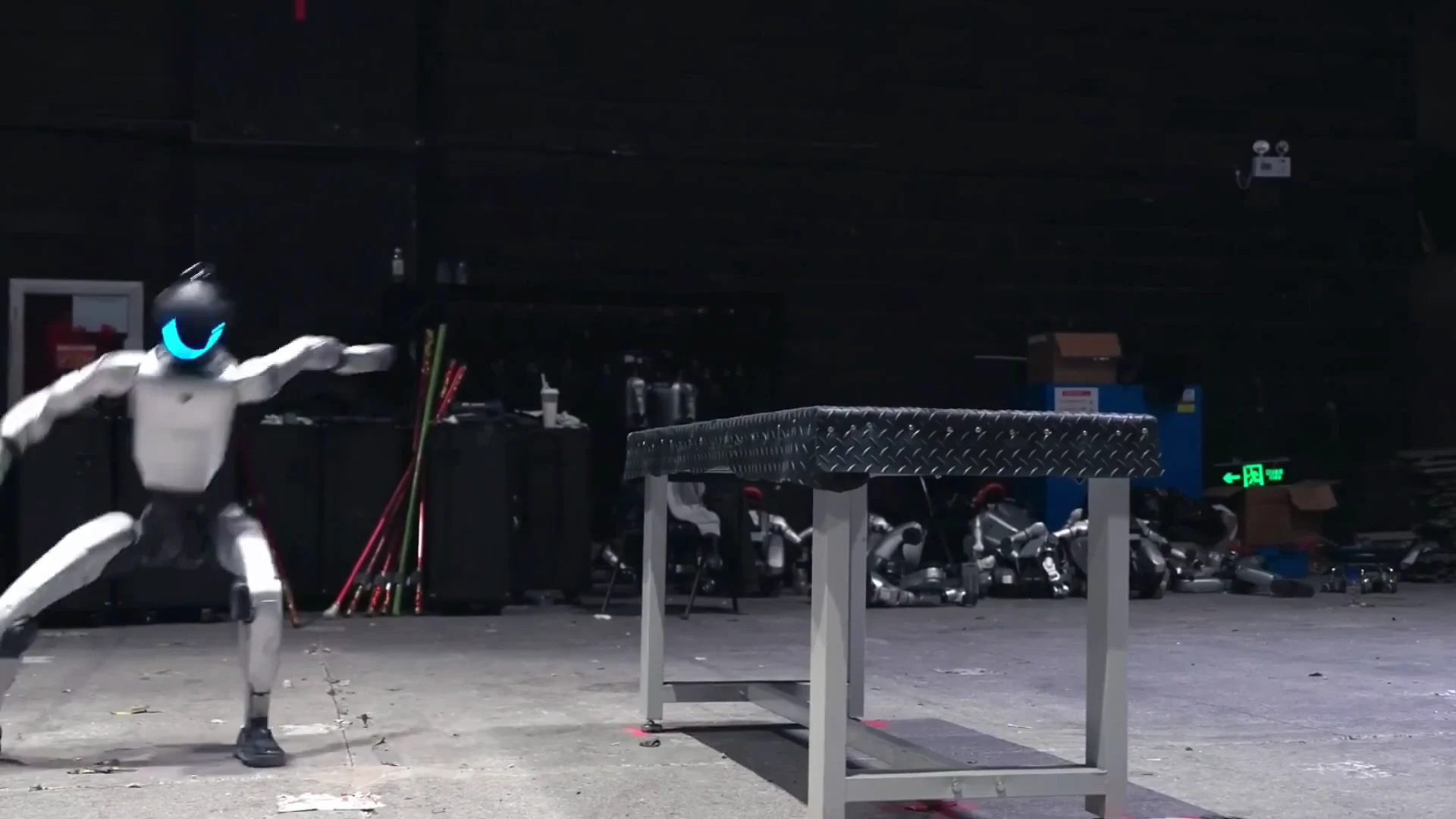 Unitree G1 humanoid robot in warehouse training environment showing indoor operation with two-hour battery runtime