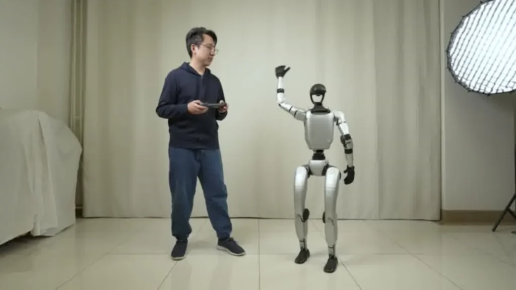 Unitree G1 humanoid robot in a product showcase environment demonstrating its dexterous hand capabilities at an event
