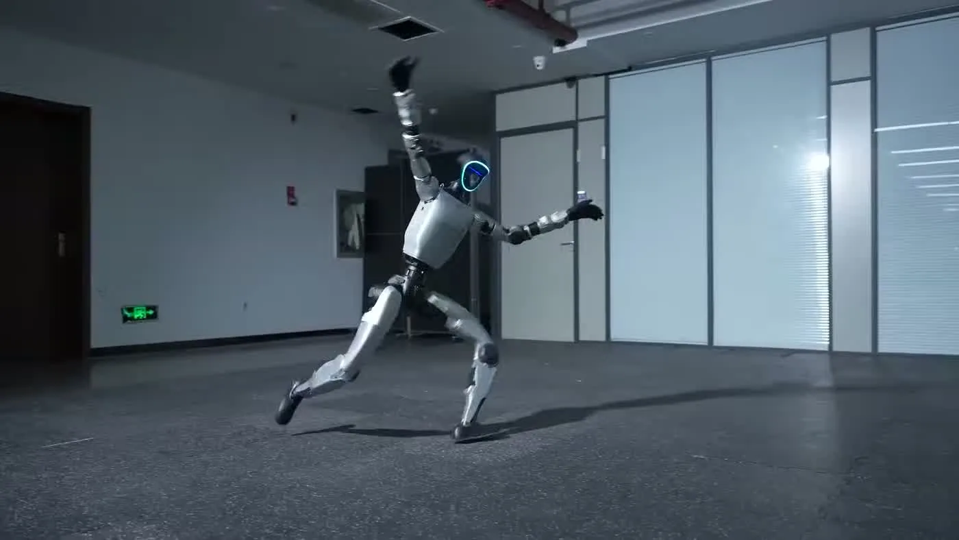 Unitree G1 humanoid robot standing upright in an indoor venue showing full body frame and mechanical joint structure