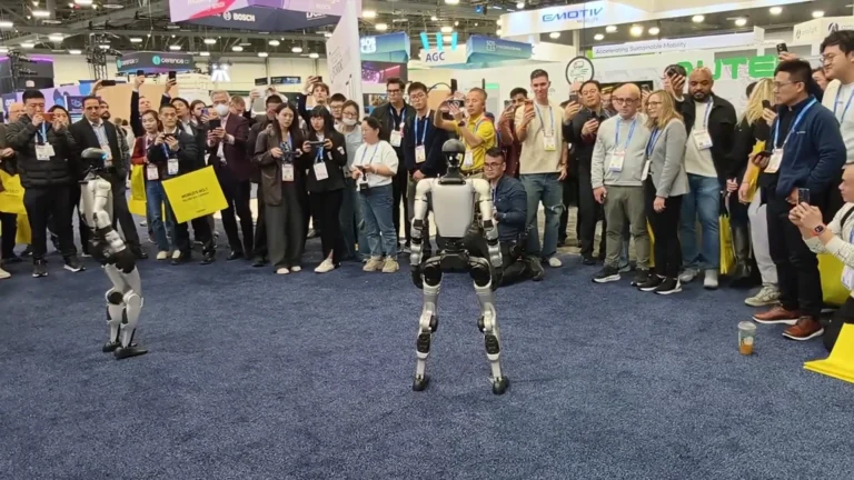 Unitree G1 humanoid robot at CES 2026 with crowd filming on phones — humanoid robots are inherently viral at events