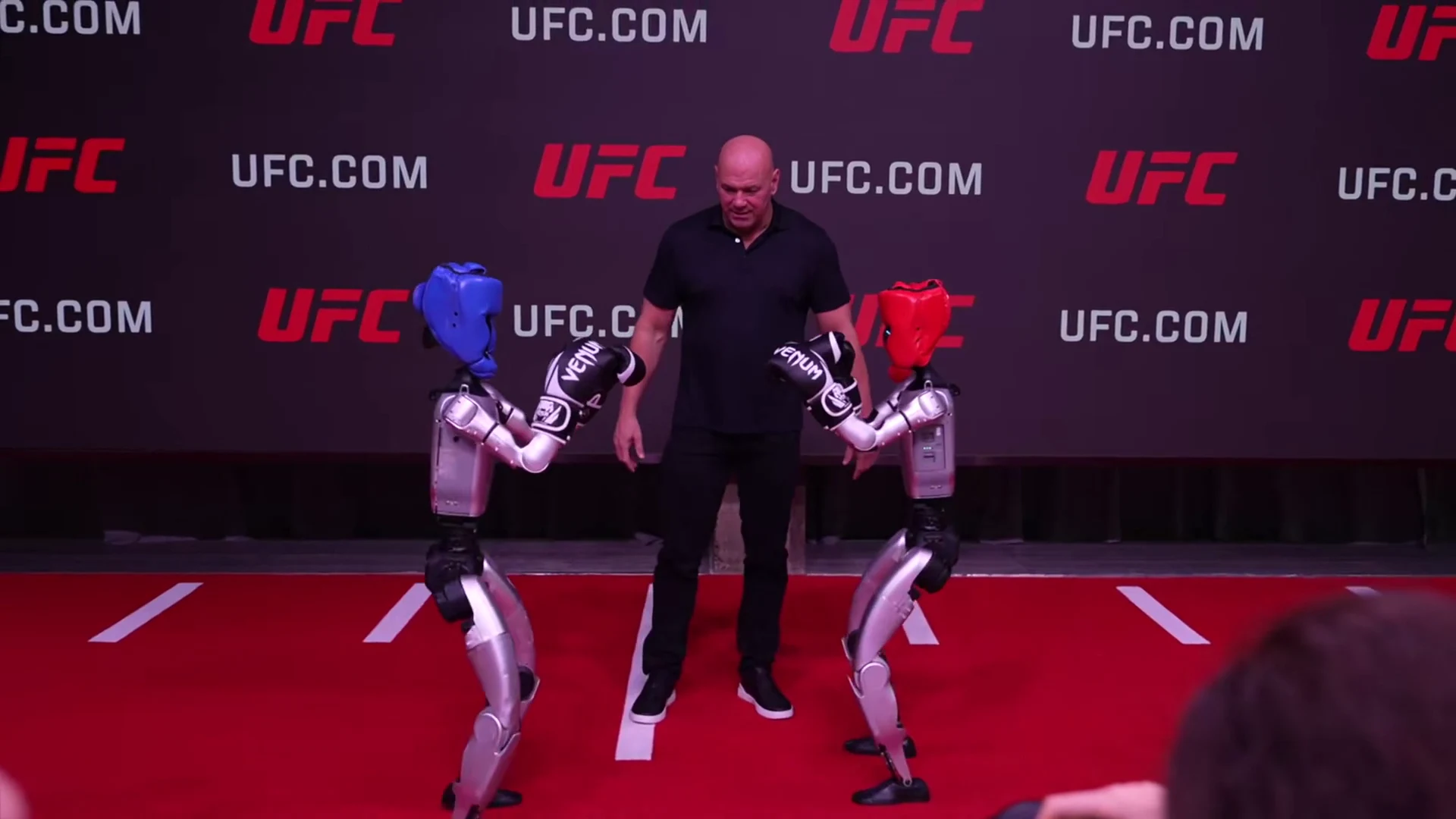 Unitree G1 humanoid robot at UFC press event generating media coverage and social proof through live demonstration