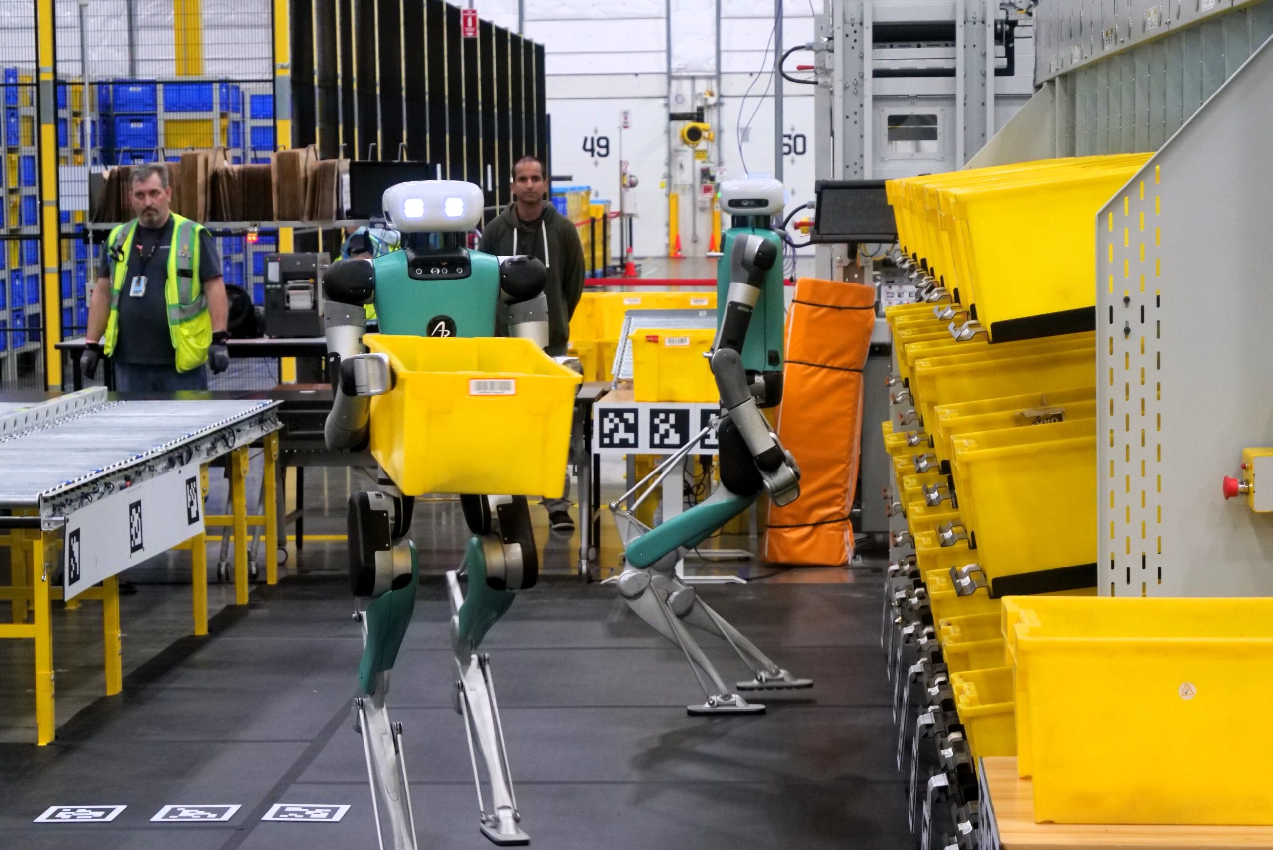 Agility Robotics Digit bipedal humanoid robot in warehouse logistics demonstrating autonomous movement and package handling