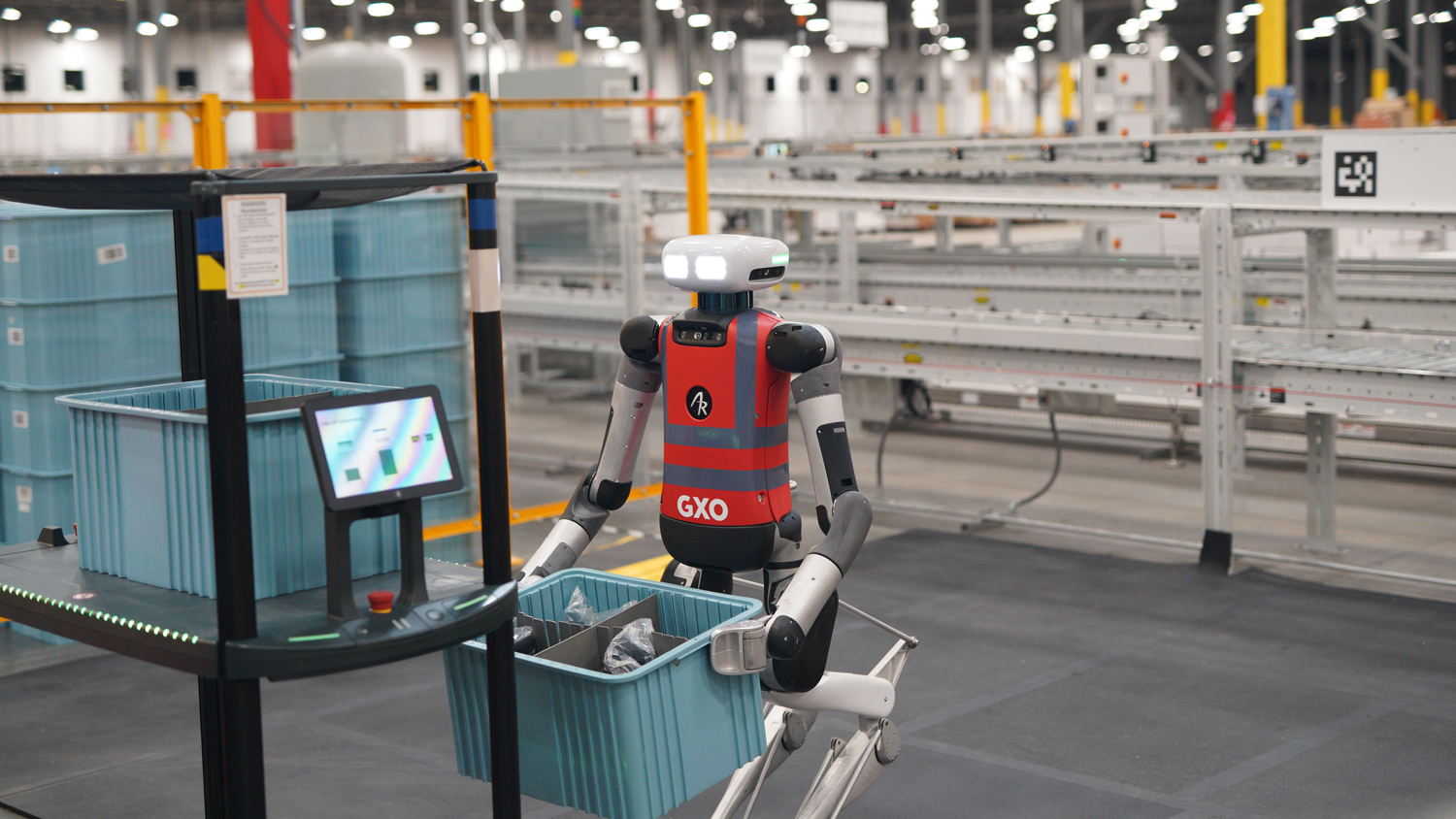 Agility Robotics Digit humanoid robot working in a GXO warehouse moving totes
