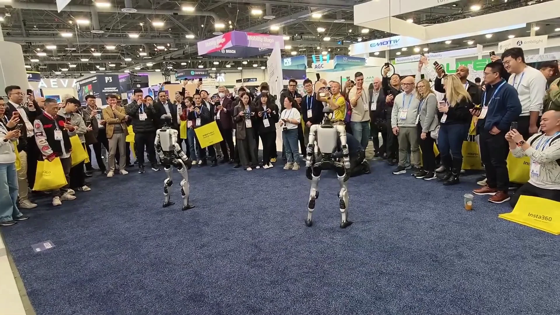 Unitree G1 humanoid robot at CES 2026 trade show surrounded by a crowd of attendees