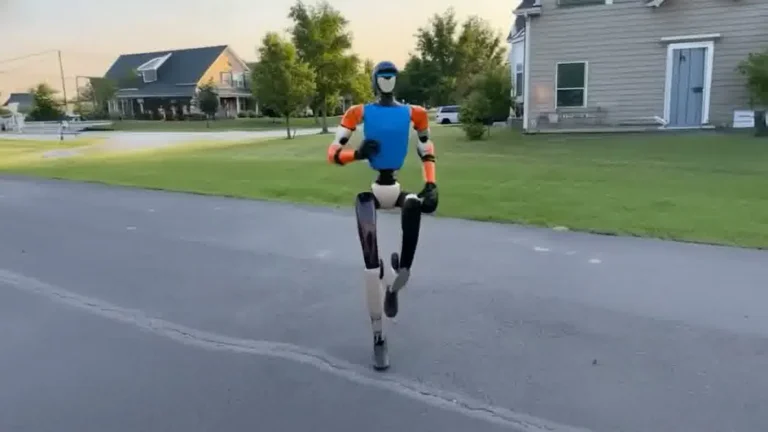 Unitree G1 humanoid robot at a corporate event venue standing in front of an audience during a live presentation moment
