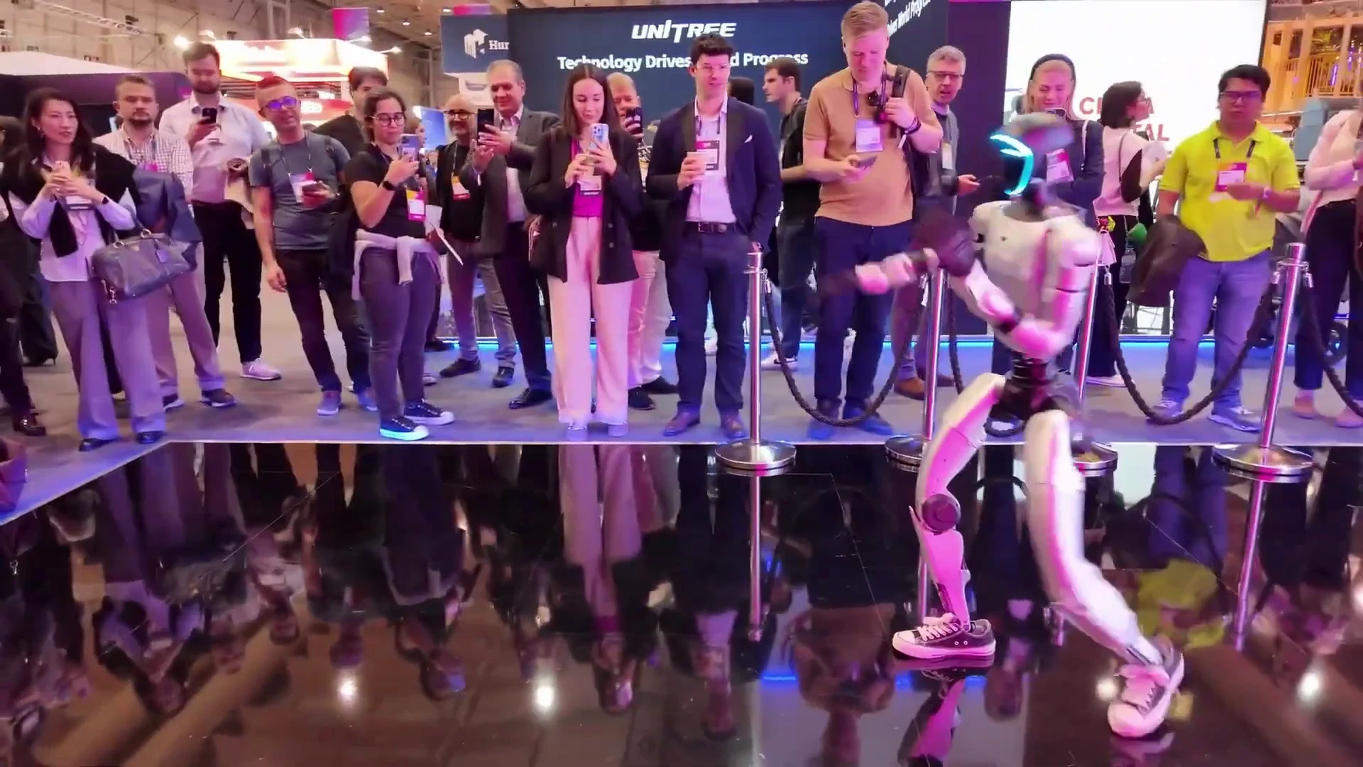 Unitree G1 humanoid robot demonstrating service and hospitality capabilities in an indoor venue setting