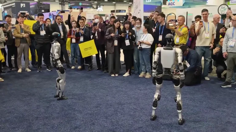 Unitree G1 humanoid robot performing live demo to attendees at CES 2026 trade show booth in Las Vegas