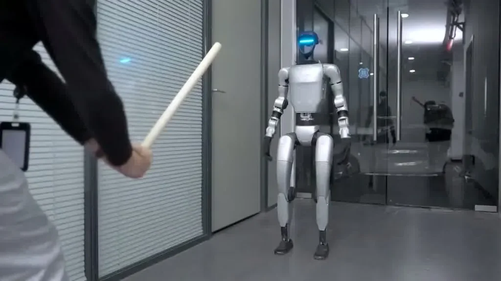 Unitree G1 humanoid robot performing a live demonstration at an indoor trade show booth for event attendees