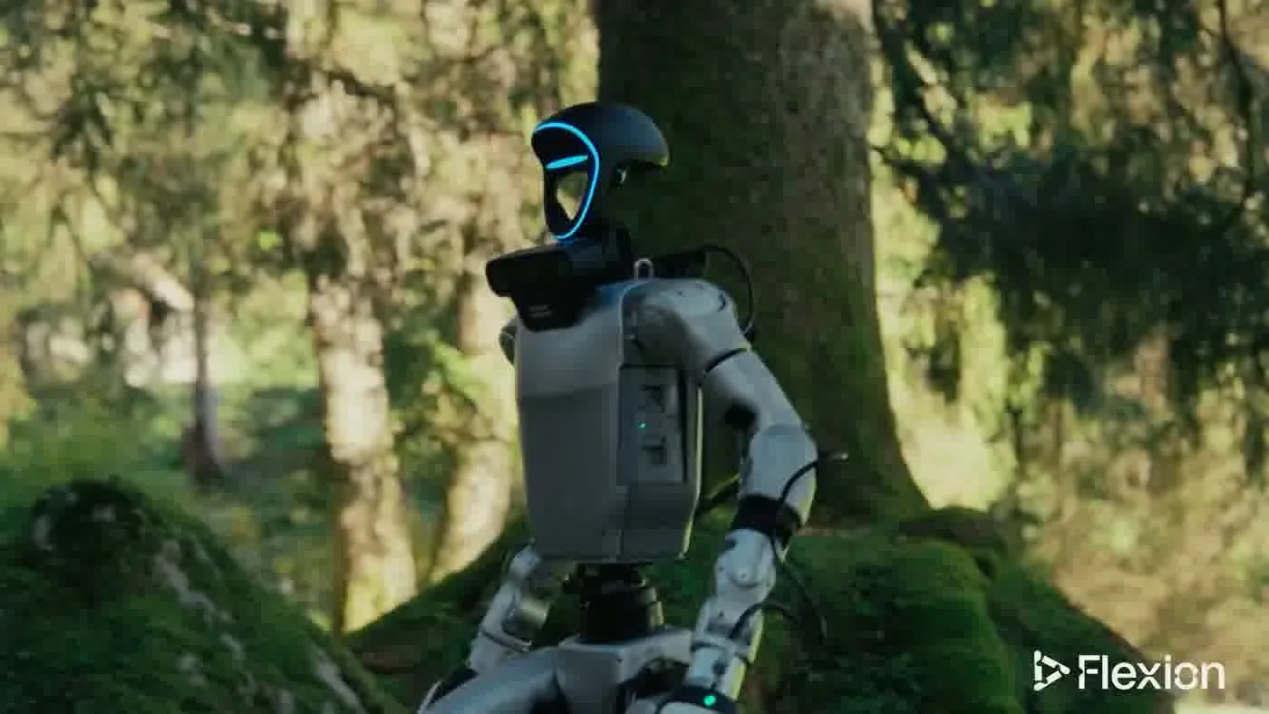 Unitree G1 humanoid robot responding to visitor questions at an indoor event venue with staff nearby