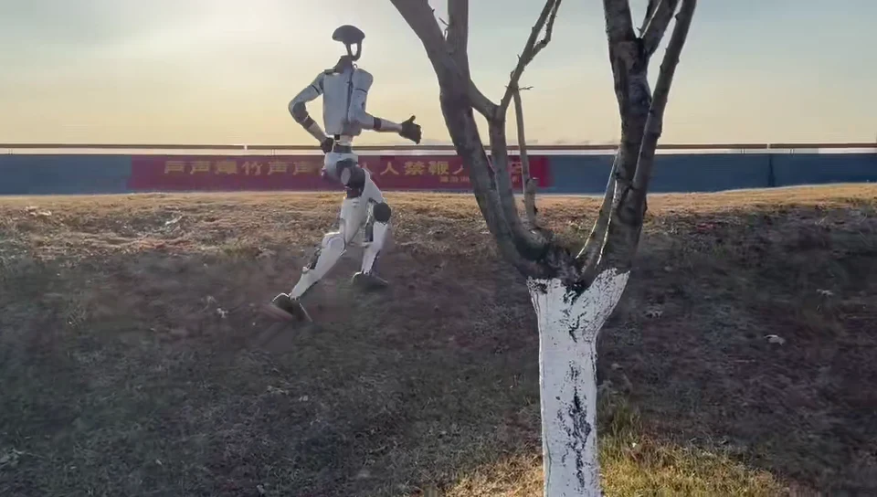 Unitree G1 humanoid robot jogging through a public park on an outdoor mobility run