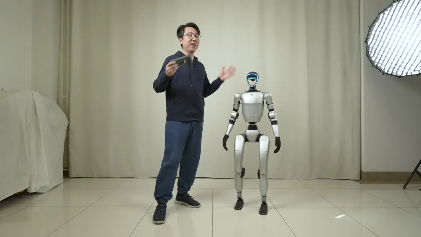 Unitree G1 humanoid robot on an automotive brand activation floor beside a vehicle at the Miami International Auto Show