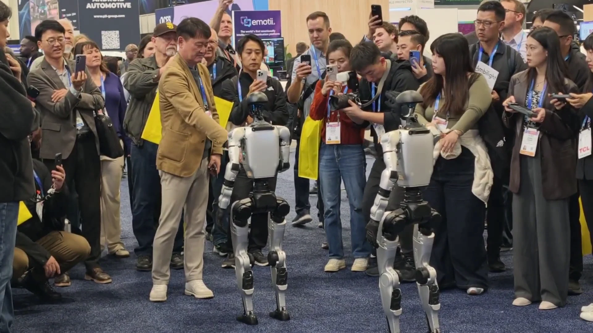 Unitree G1 humanoid robots at a Las Vegas CES trade show in two-robot venue setup for convention center robot rental