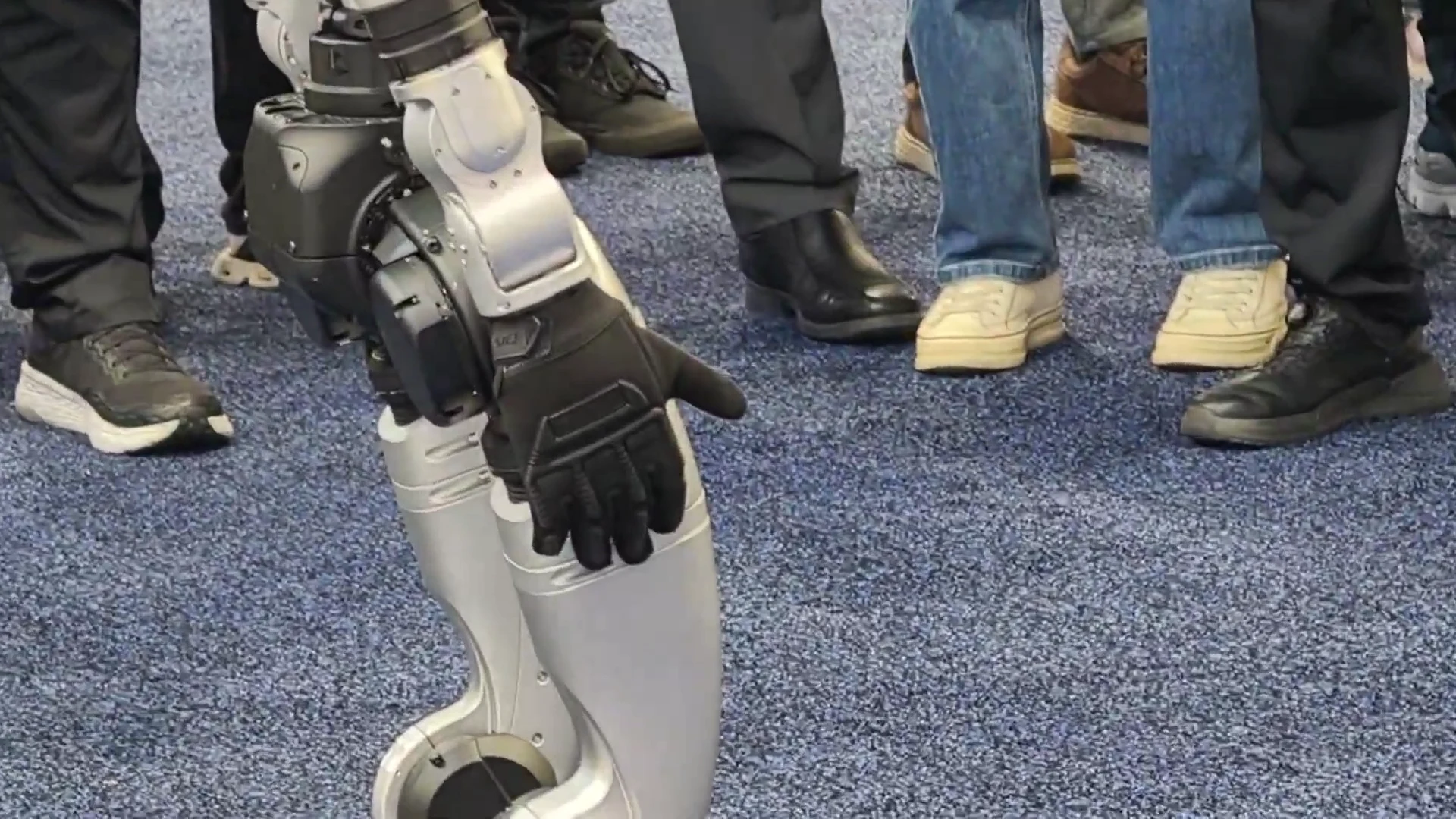 Unitree G1 humanoid robot demonstrating at a crowded event booth, illustrating a brand activation deployment
