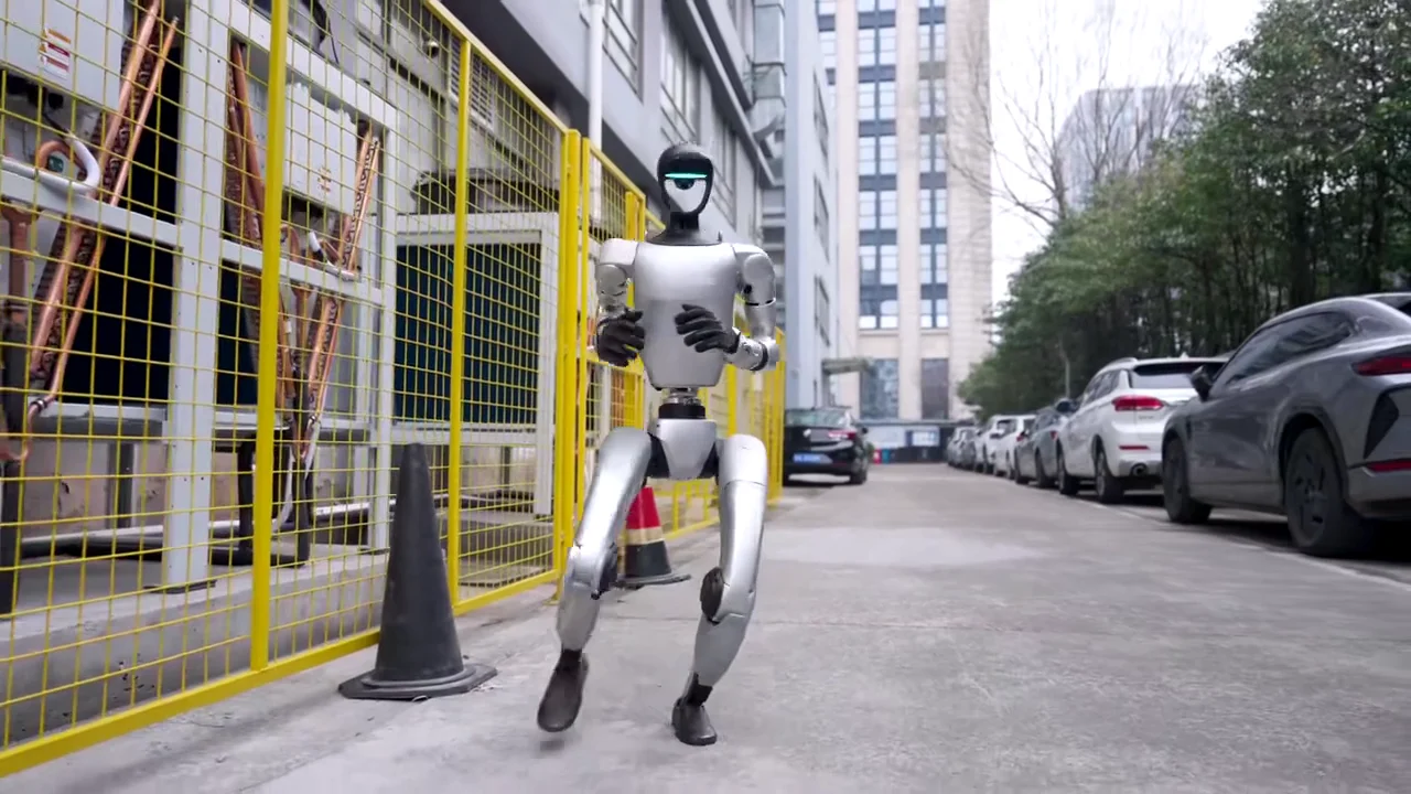 Unitree G1 humanoid robot walking in an urban environment during an outdoor brand activation event