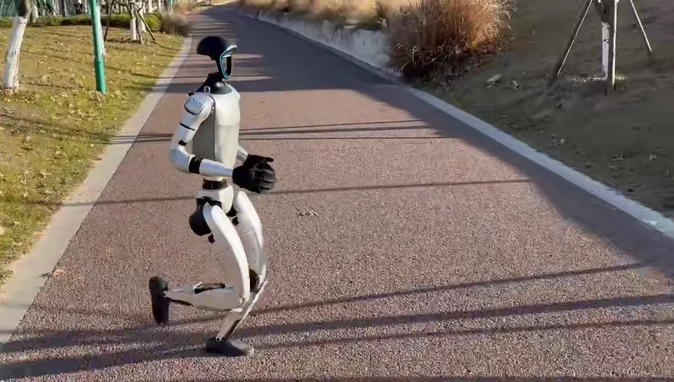 Unitree G1 humanoid robot jogging outdoors, showing the mobility and deployment capability for event activations