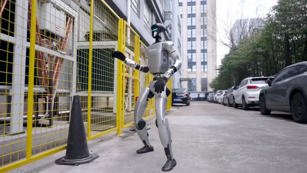 Unitree G1 humanoid robot walking outdoors demonstrating its mobility and 127cm frame during a public deployment in 2026