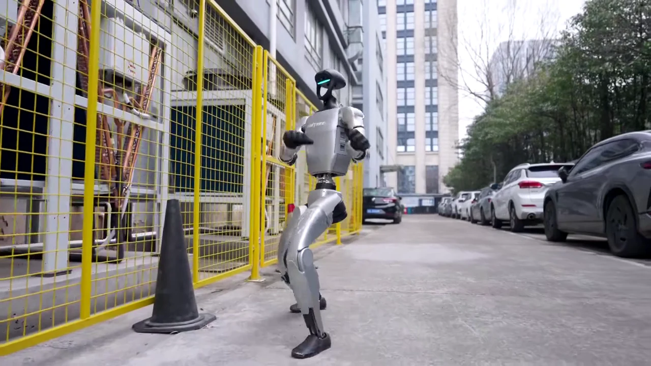 Unitree G1 humanoid robot walking upright outdoors, demonstrating mobility for museum exhibit planning