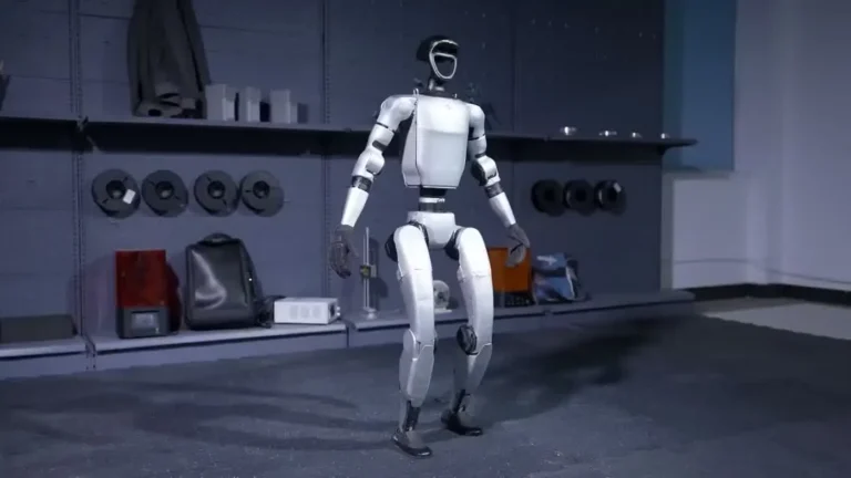 Unitree G1 humanoid robot standing upright in a studio, showing its 127cm height and full-body white and silver design