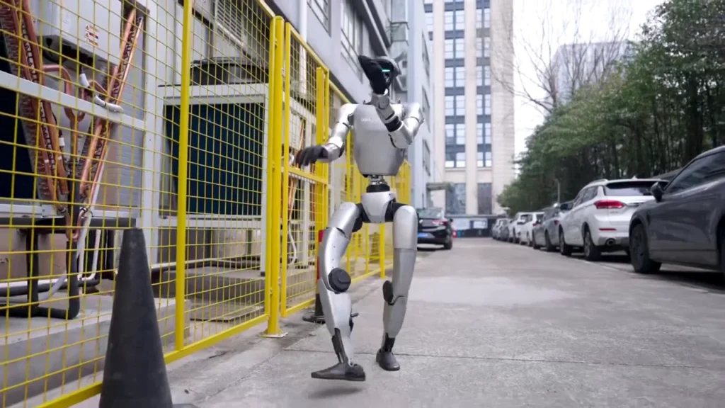 Unitree G1 humanoid robot walking outdoors on a city sidewalk, demonstrating mobility for European rental deployments in 2026