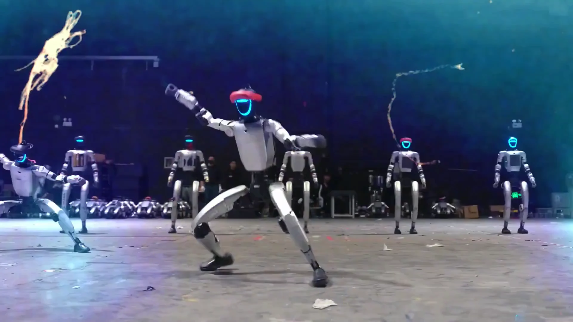 Multiple Unitree G1 robots on a lit stage at a live event, illustrating European brand activation deployments 2026