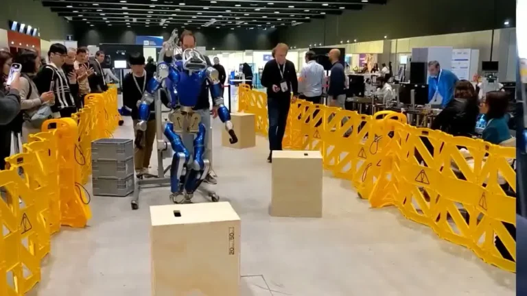 Unitree G1 humanoid robot at a UK exhibition venue showing the full hardware for UK and US deployments