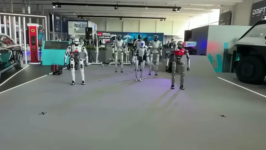 Multiple humanoid robots on display at a tech expo floor showing the crowd-drawing power of robot brand activations in 2026