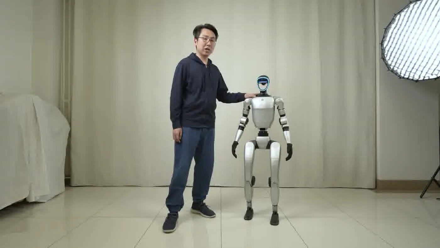 Unitree G1 humanoid robot walking through a venue corridor demonstrating the 80cm minimum doorway clearance requirement