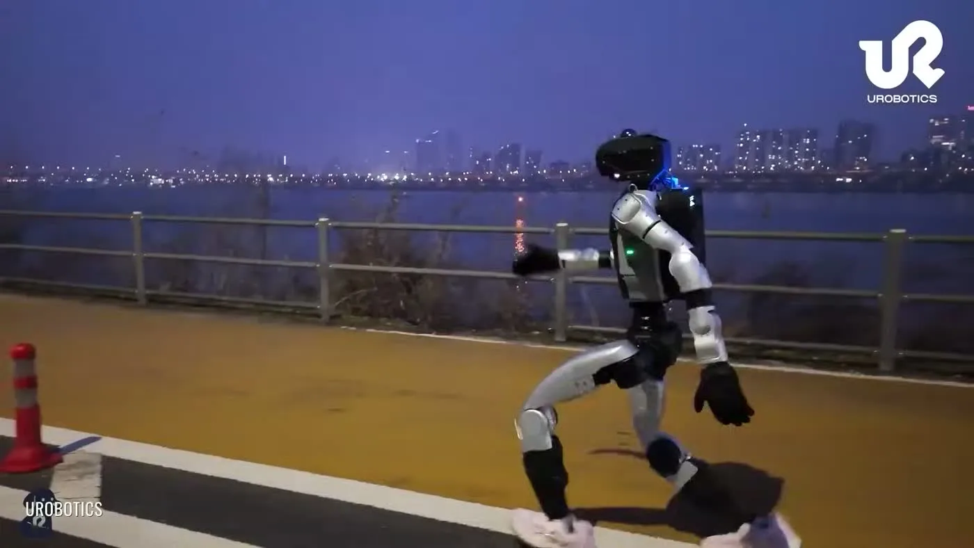 Unitree G1 humanoid robot at a public demonstration event surrounded by attendees with operator visible in the background