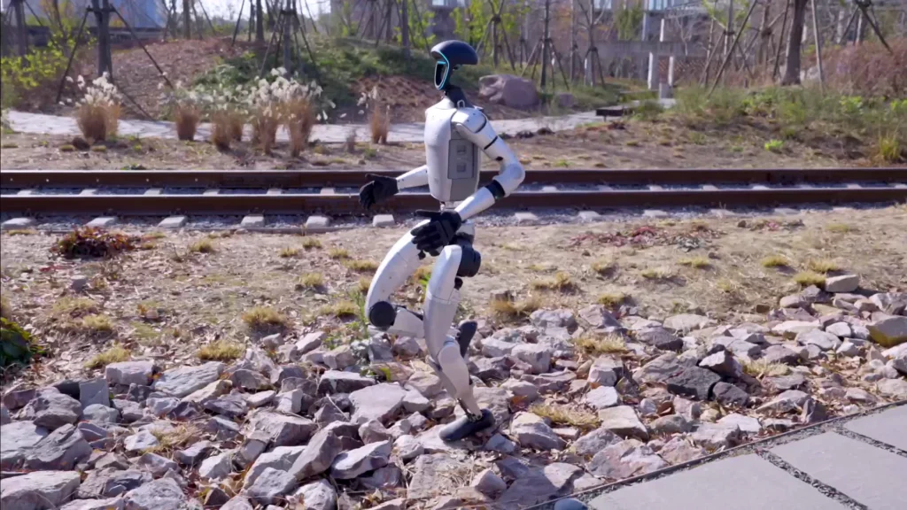 Unitree G1 humanoid robot running across outdoor terrain demonstrating real-world mobility and dynamic balance control