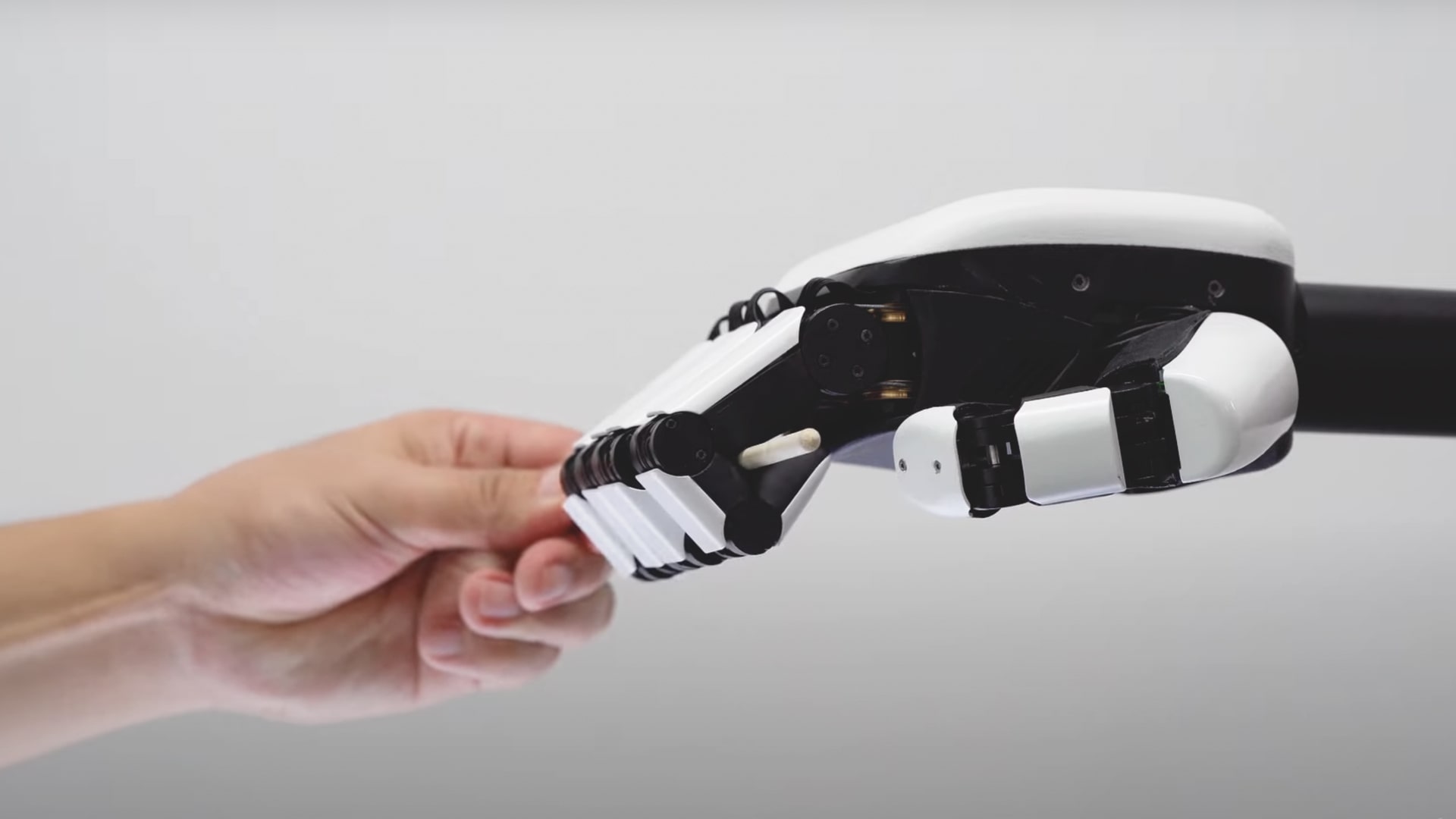 Dexcel Apex robotic dexterous hand close-up showing five-finger articulated grip